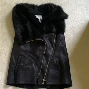 Fleece, faux fur, and coated suede vest